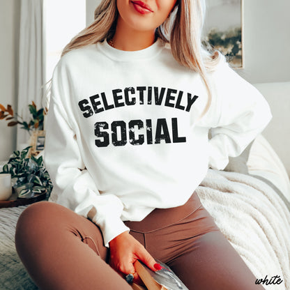 PRE-ORDER Selectively Social Sweatshirt 7 Colors S-3X displayed on a model sitting indoors in a comfortable setting.