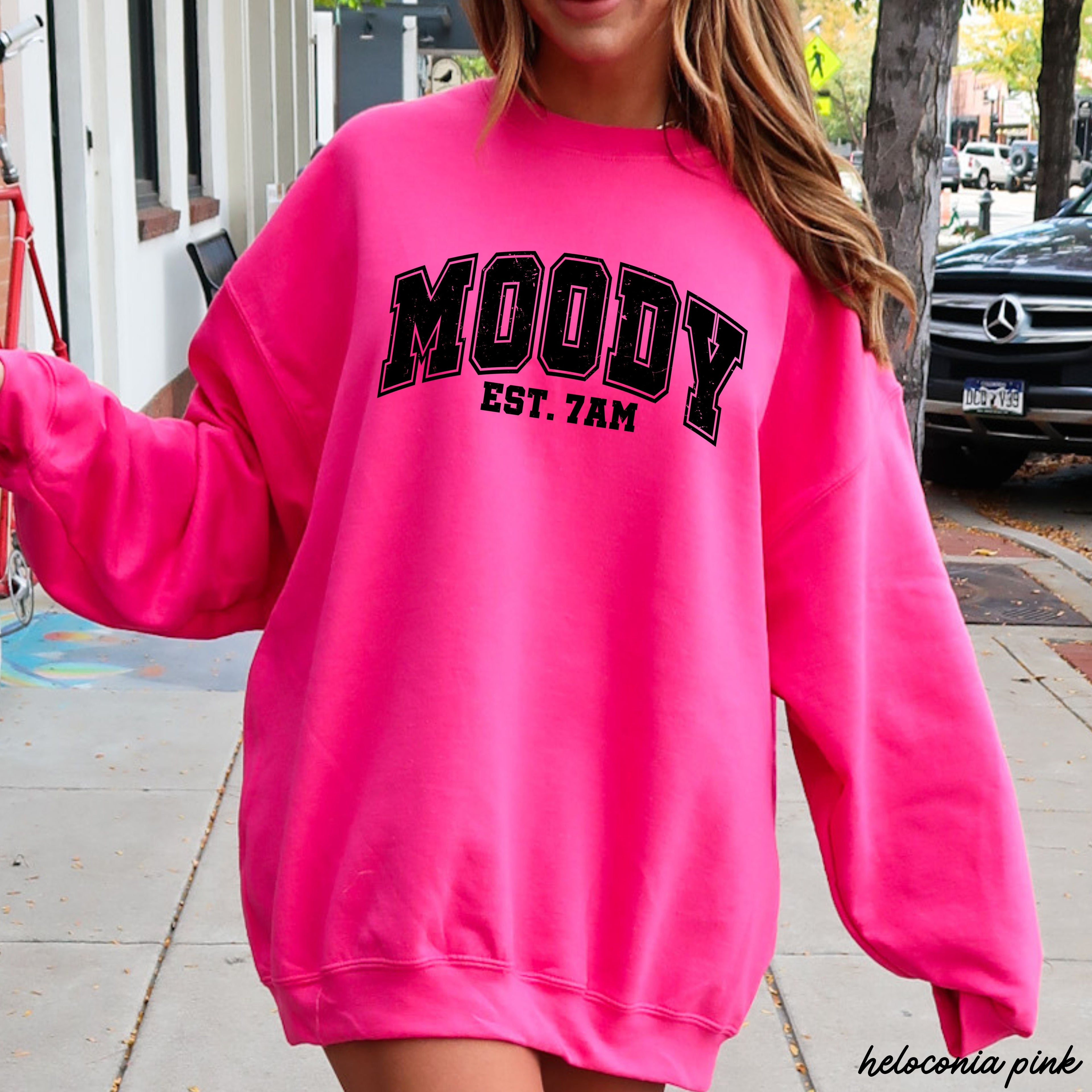 Moody 7am Sweatshirt 7 Colors S-3X in bright pink color worn by a model outdoors.