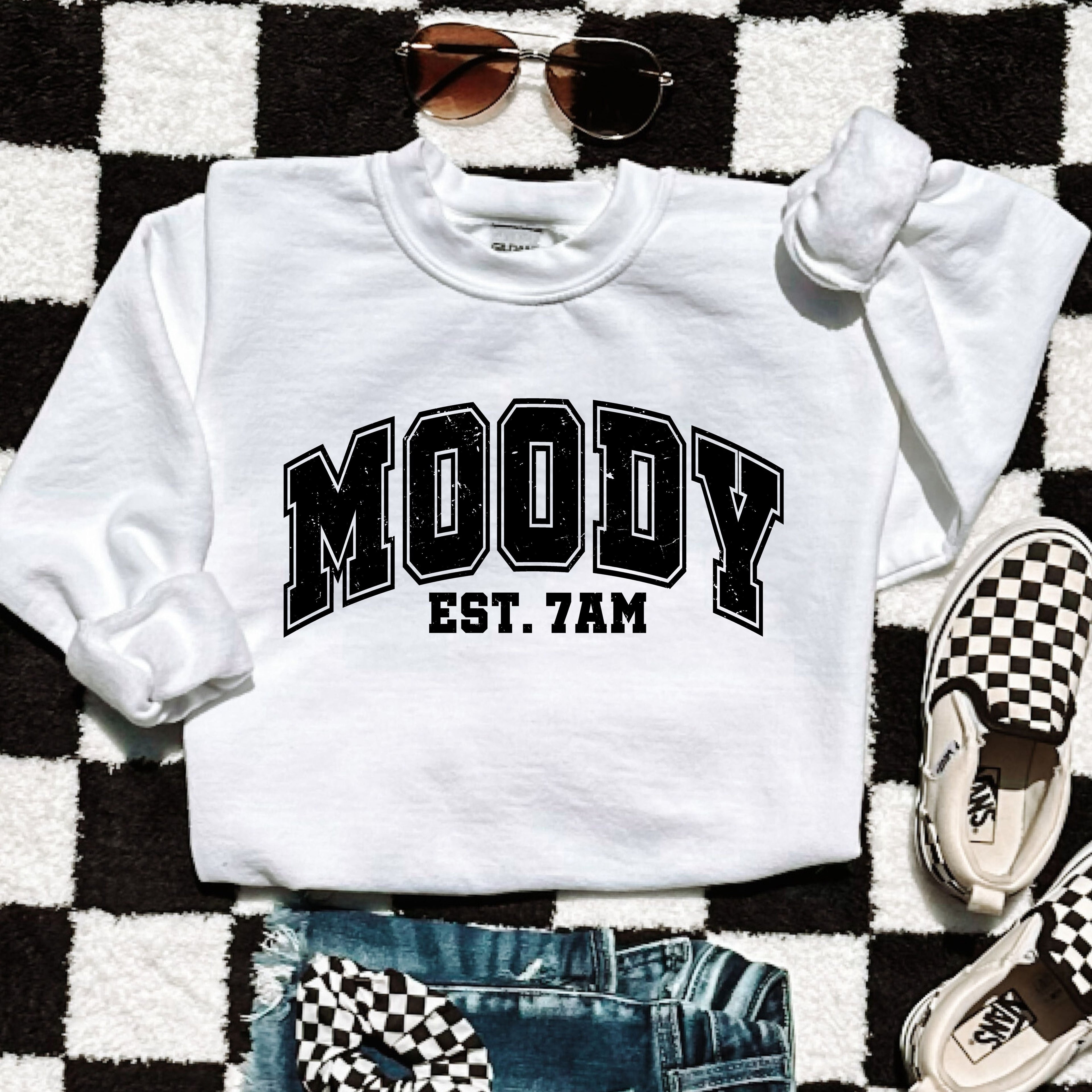 Moody 7am Sweatshirt 7 Colors S-3X displayed with checkered shoes and sunglasses on a patterned background.